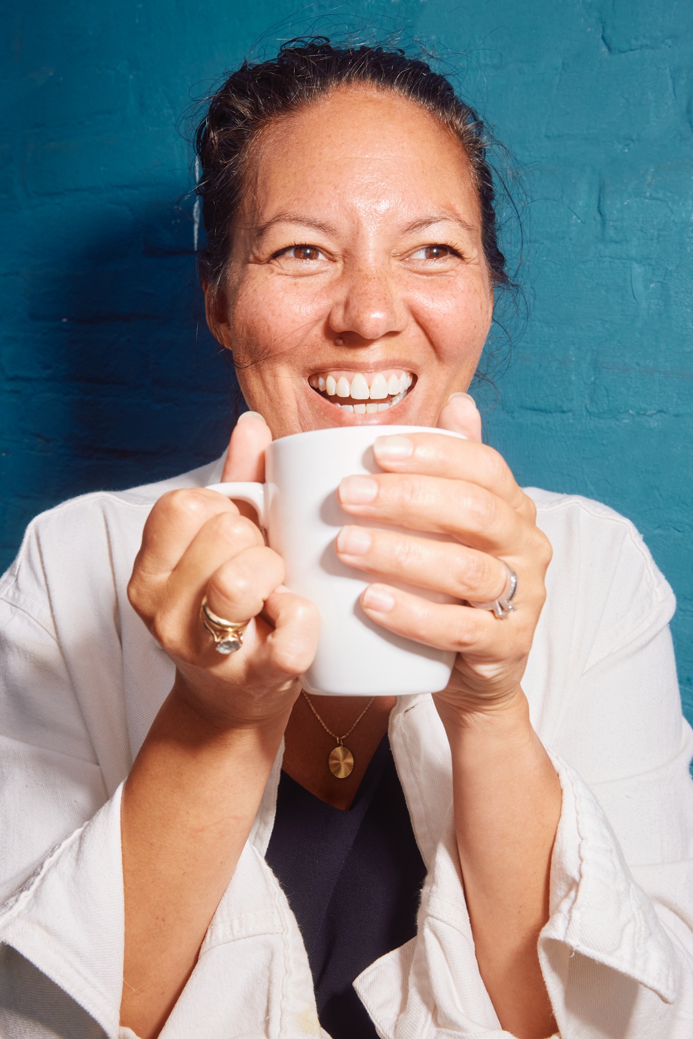 Happy team member with coffee cup