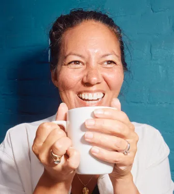 Happy team member with coffee cup Happy team member with coffee cup