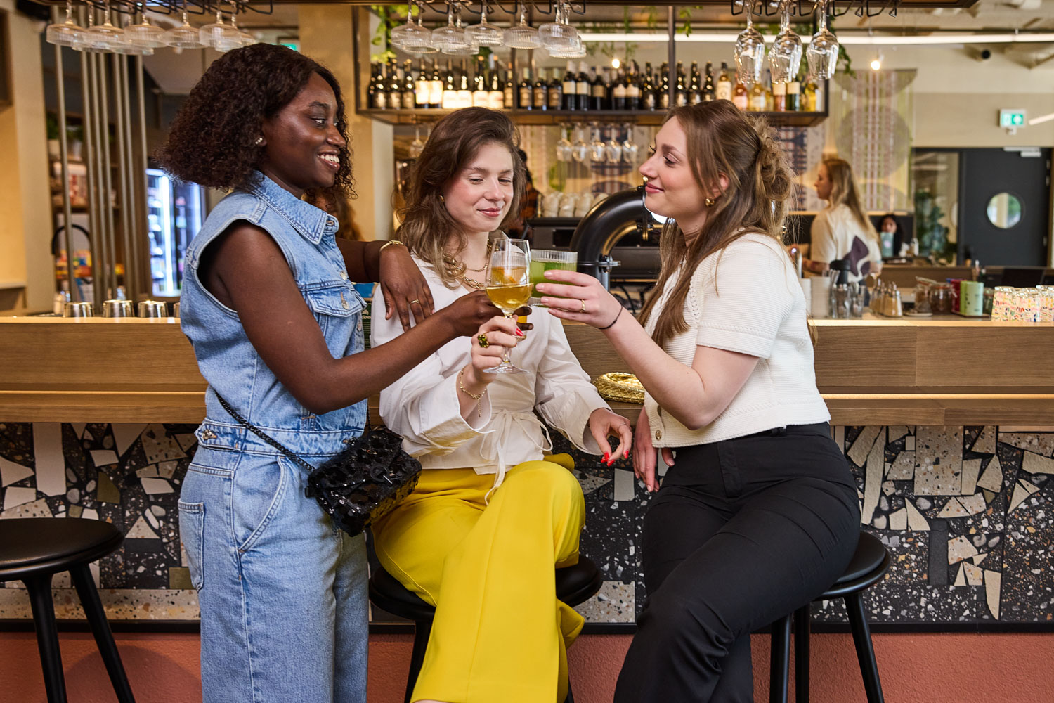 trio sharing drinks in the stylish u bar at the usual