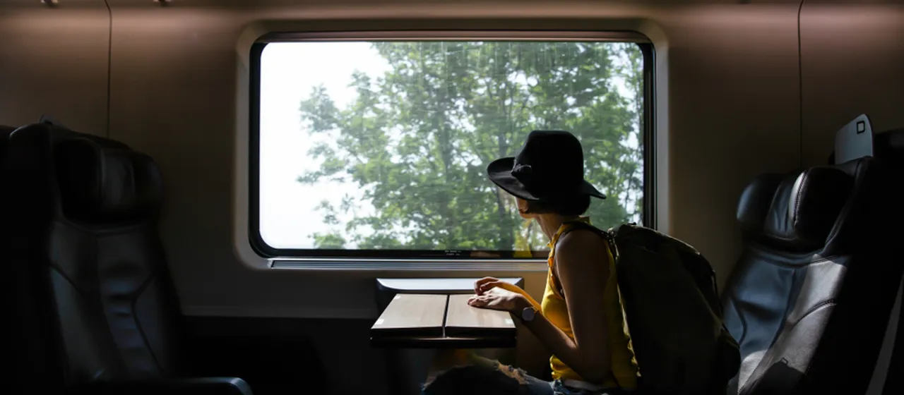 Girl on a train looking out Girl on a train looking out
