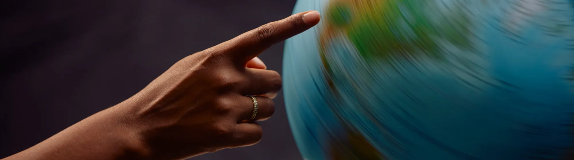 Where to travel next Hand with Globe